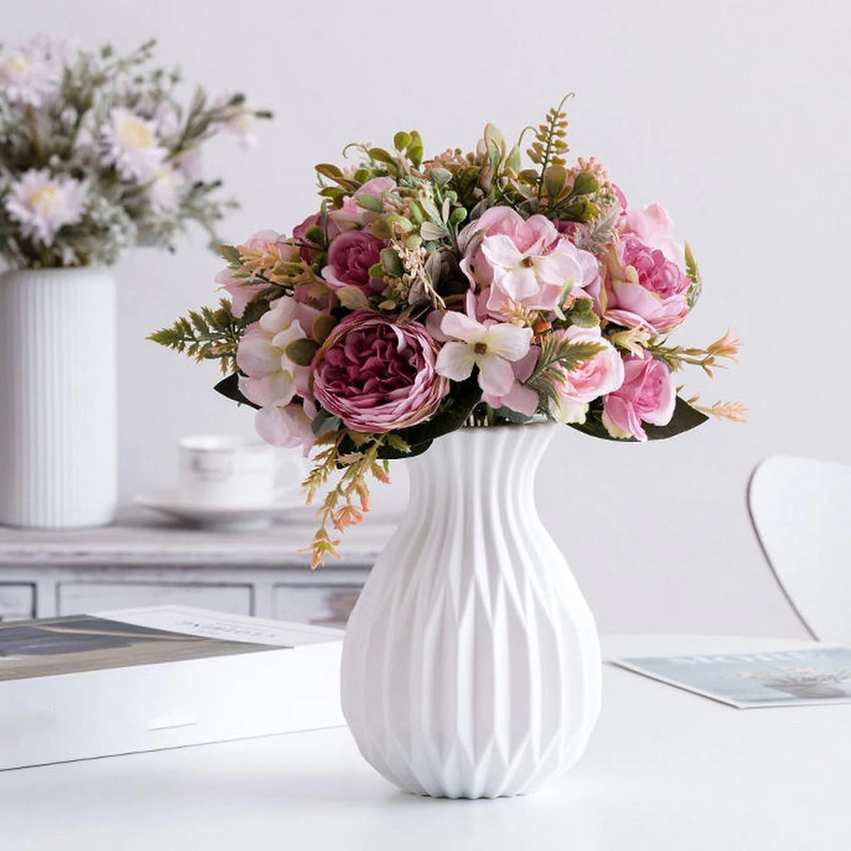 White ceramic look vase for bonsai display on a minimalist natural wooden surface