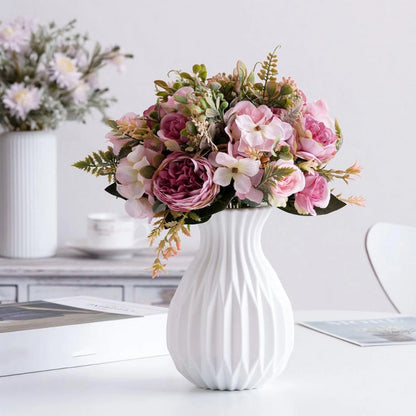 White ceramic look vase for bonsai display on a minimalist natural wooden surface