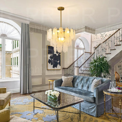 Glass chandelier at 23.6 in across with downward shade direction