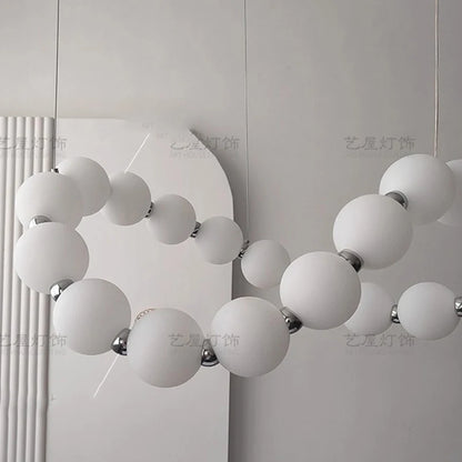 Black ironwork and acrylic strip chandelier with included bulbs