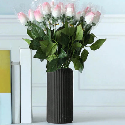 Close-up of ceramic-like matte finish on striped plastic flower vase