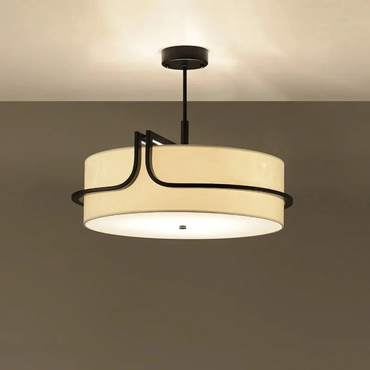 Circular wabi sabi chandelier with a round fabric shade on iron