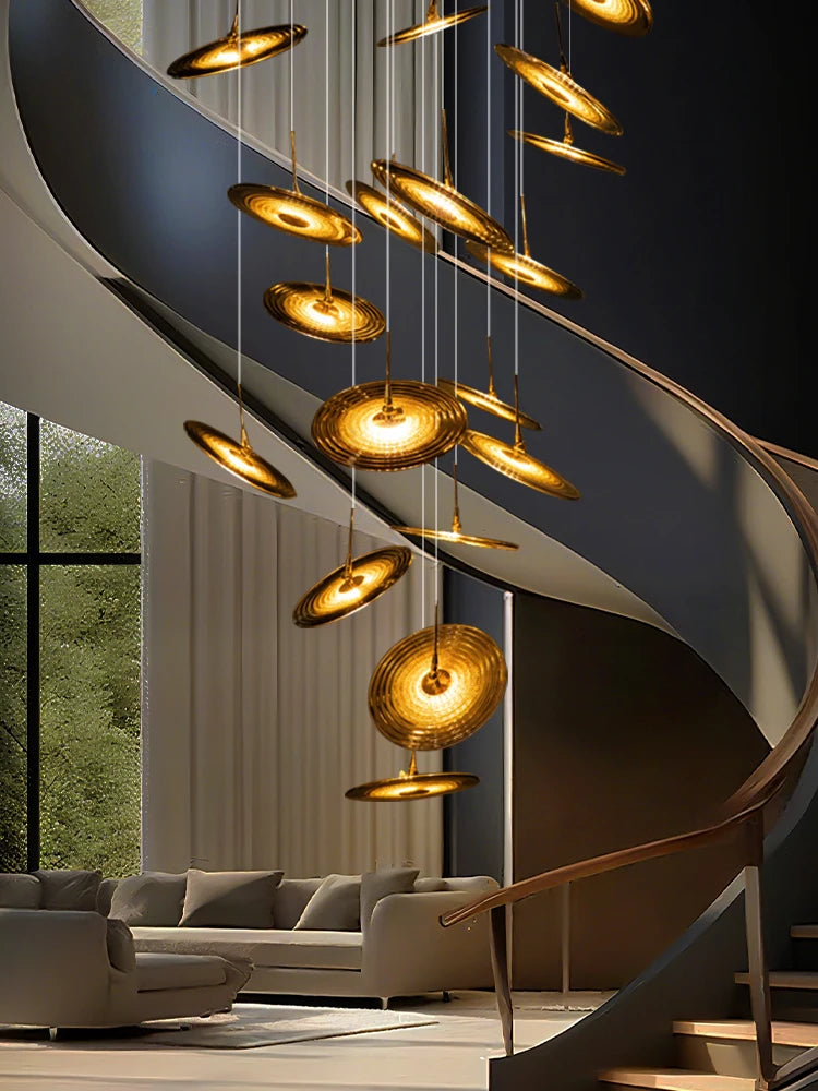 Thirty six light spiral chandelier dropping through a stair void