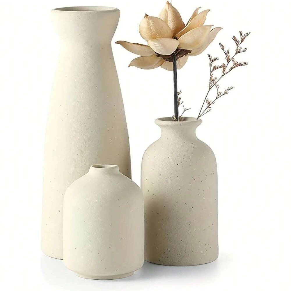 Beige ceramic bohemian vase collection on wood console table vignette
