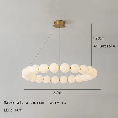 Iron ring chandelier strung with rows of white decorative beads