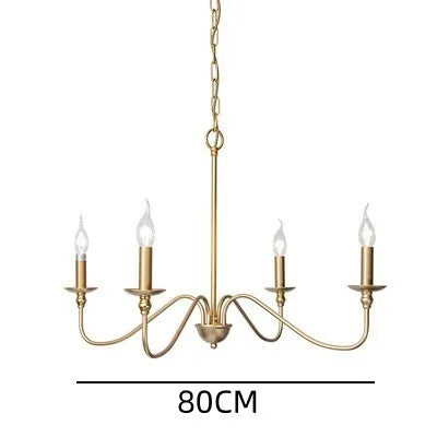Black metal chandelier with six exposed sockets above a dining table