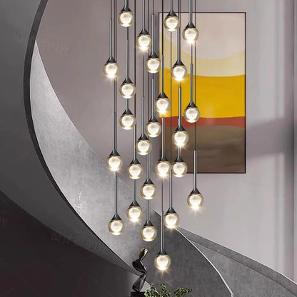 Black framed crystal chandelier lit in warm white down a void