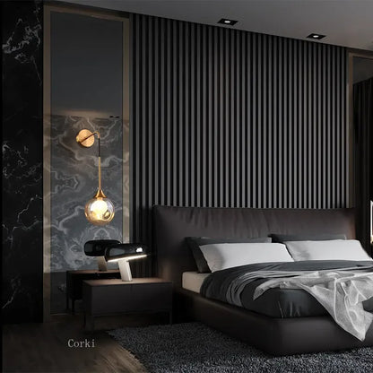gold glass wall sconce, installed in a room interior setting