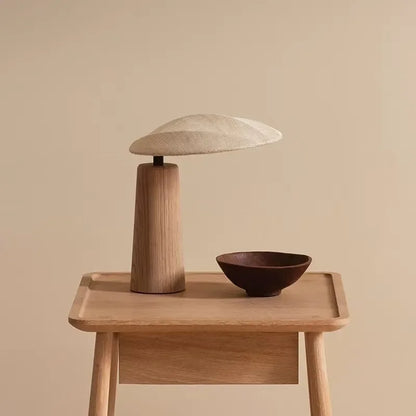 Japanese minimalist wood lamp on bedside table in serene bedroom
