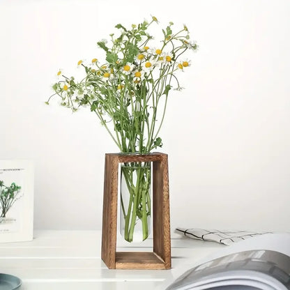 Two wooden hydroponic propagation vases together on a study windowsill display