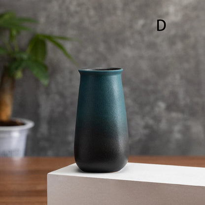 Group of four frosted matte ceramic small bud vases in all style variants together