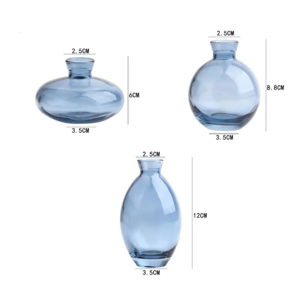 Three colorways of mini glass flower vase shown together on shelf
