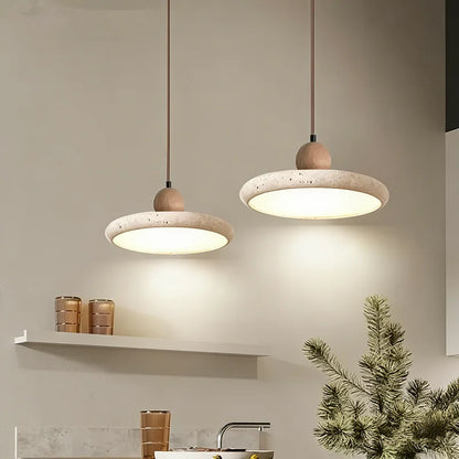 Travertine stone chandelier with a carved shade below a turned wood collar