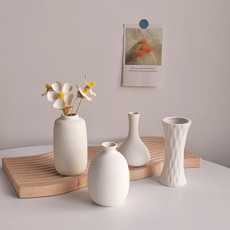 Nordic white ceramic plant bottle with flower stems