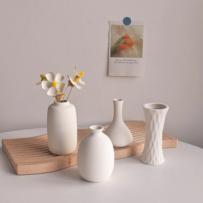 Nordic white ceramic plant bottle with flower stems
