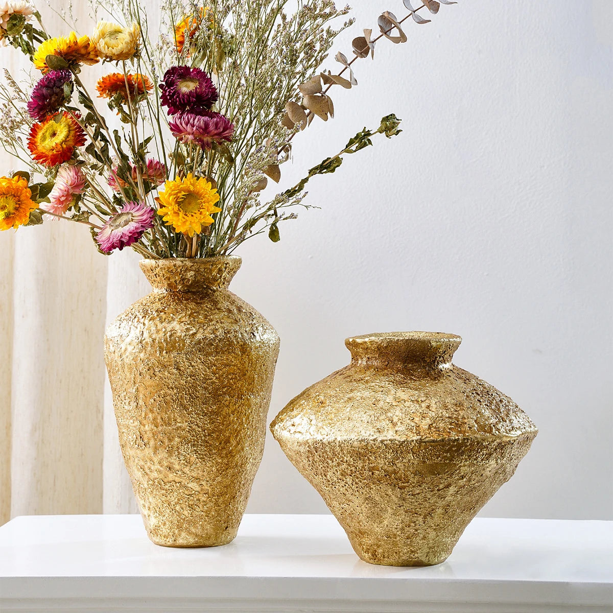 Retro antique gold earthenware jar vase short wide style on a wooden console