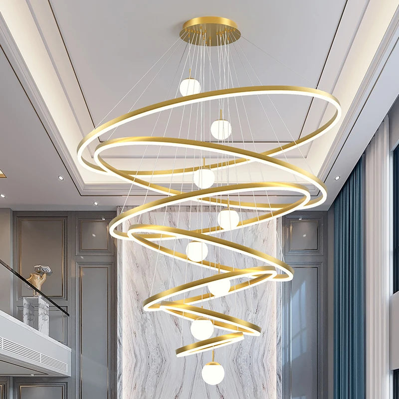 Stacked ring metal chandelier with lit rings stepping down in gold finish