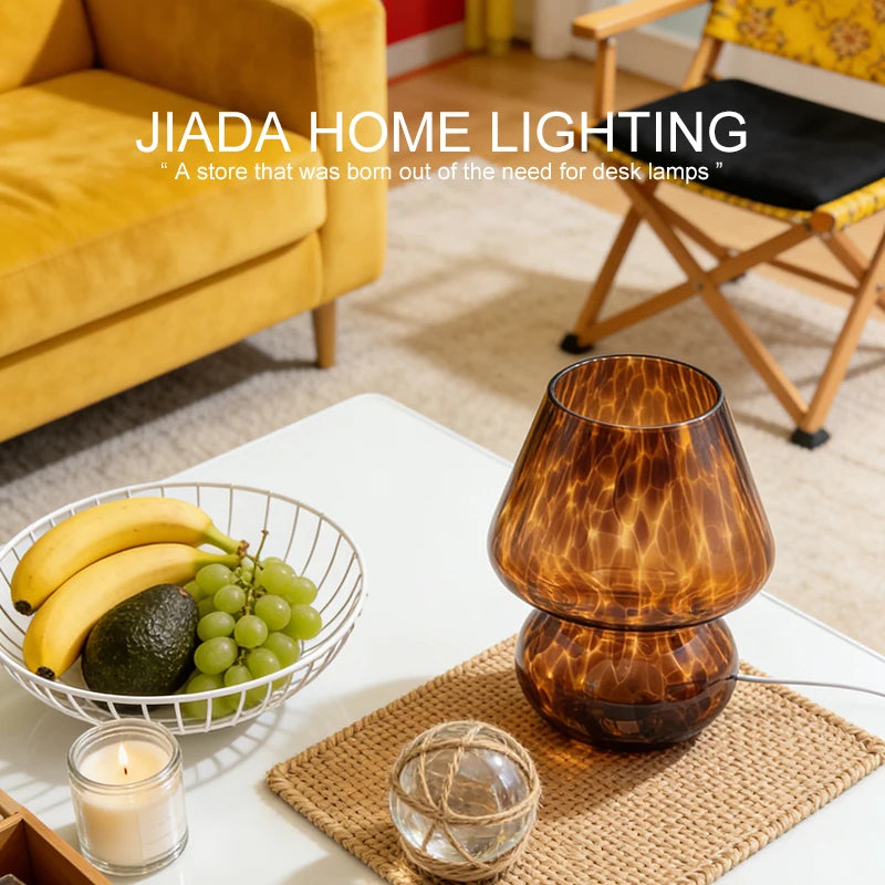 Glass mushroom lamp casting warm ambient glow on nightstand