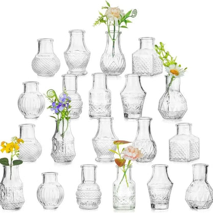 Set of 20 clear relief glass mini vases arranged on wedding table