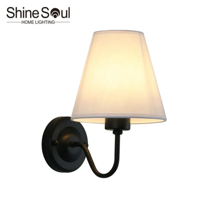 fabric shade wall sconce, front view on white background