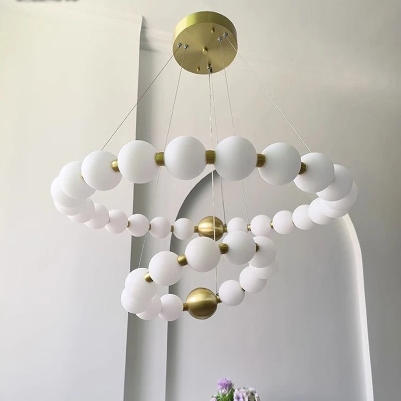 Modern acrylic ring chandelier with acrylic rings on an iron frame