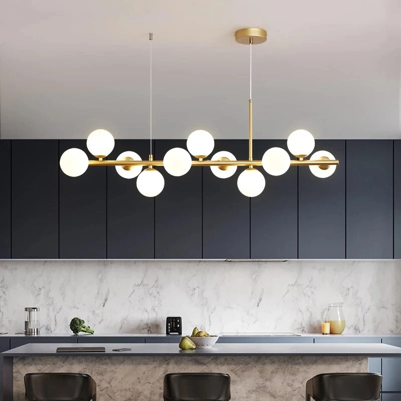 Magic bean glass chandelier with beaded shades along a nickel bar