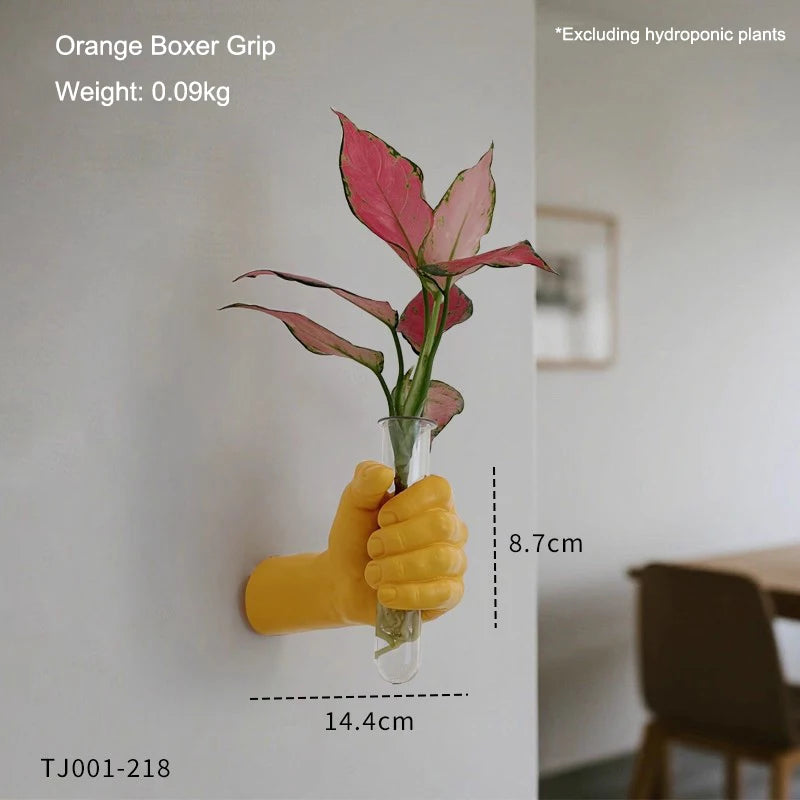 Boxer fist wall vase photographed from below showing under-mount bracket detail