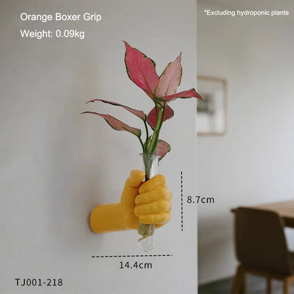 Boxer fist wall vase photographed from below showing under-mount bracket detail