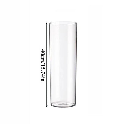 Three sizes of clear acrylic vase arranged together as floor display