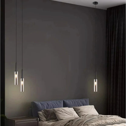 Twin head chandelier lighting two separate pools of warm light