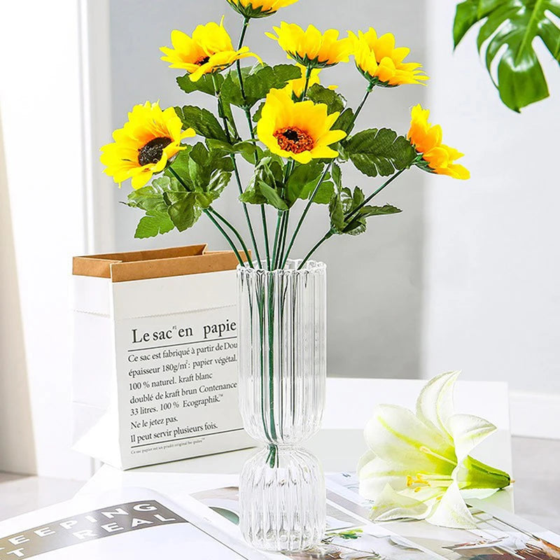 Five color options of Nordic glass sphere vases grouped together in flat lay