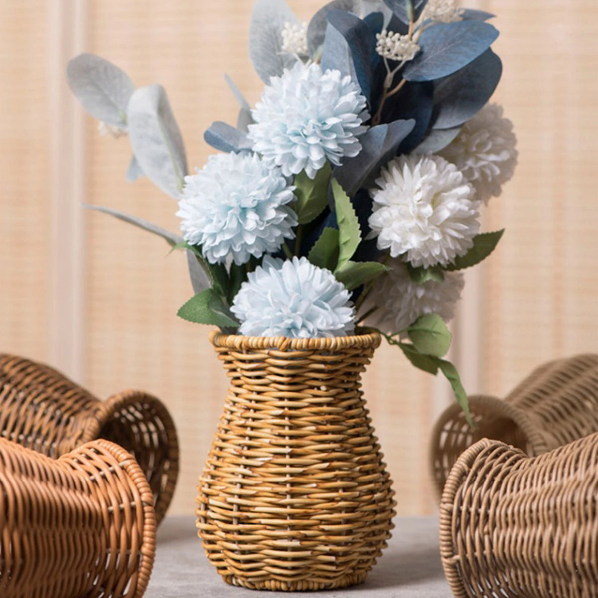 Handwoven rattan-effect flower vase style A with dried pampas on a boho shelf