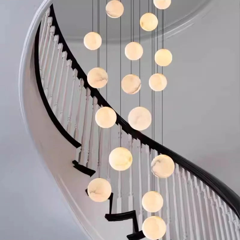 Acrylic rod detail on a slim alloy chandelier canopy in brushed gold