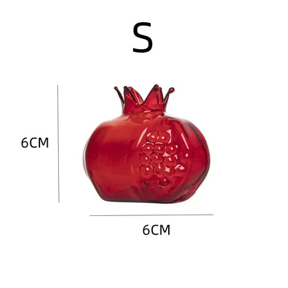 Transparent medium pomegranate vase with water and fresh stem cutting