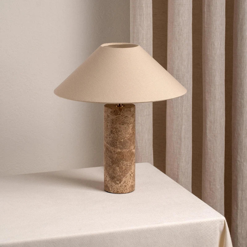Marble cylindrical lamp in living room warm ambient side view