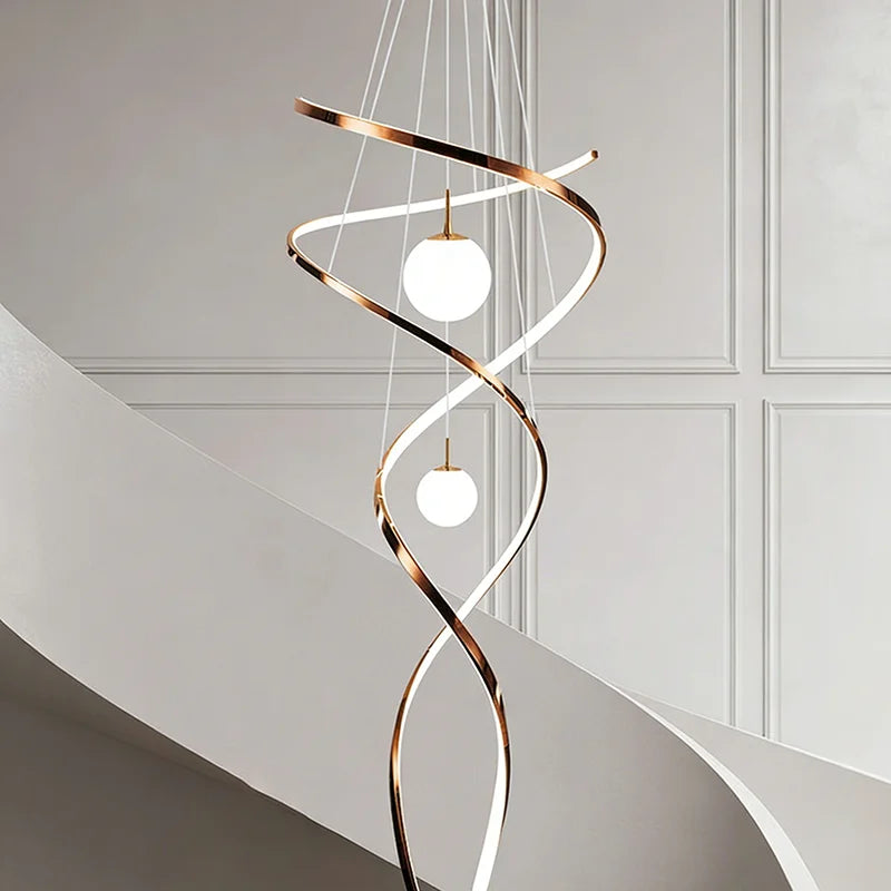 Crystal detail on an iron and stainless steel chandelier in rose gold