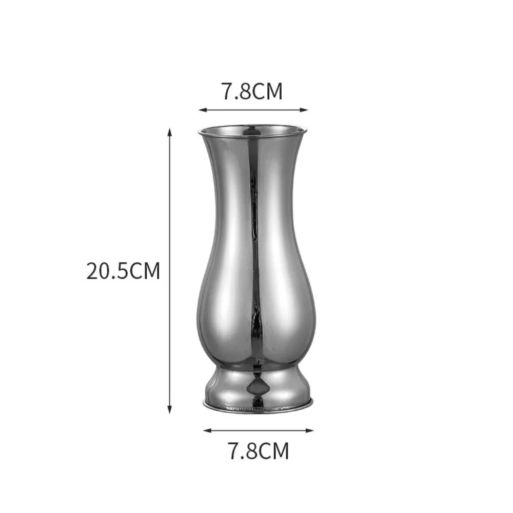 Product flat lay of all four sizes of gold stainless steel single stem vases