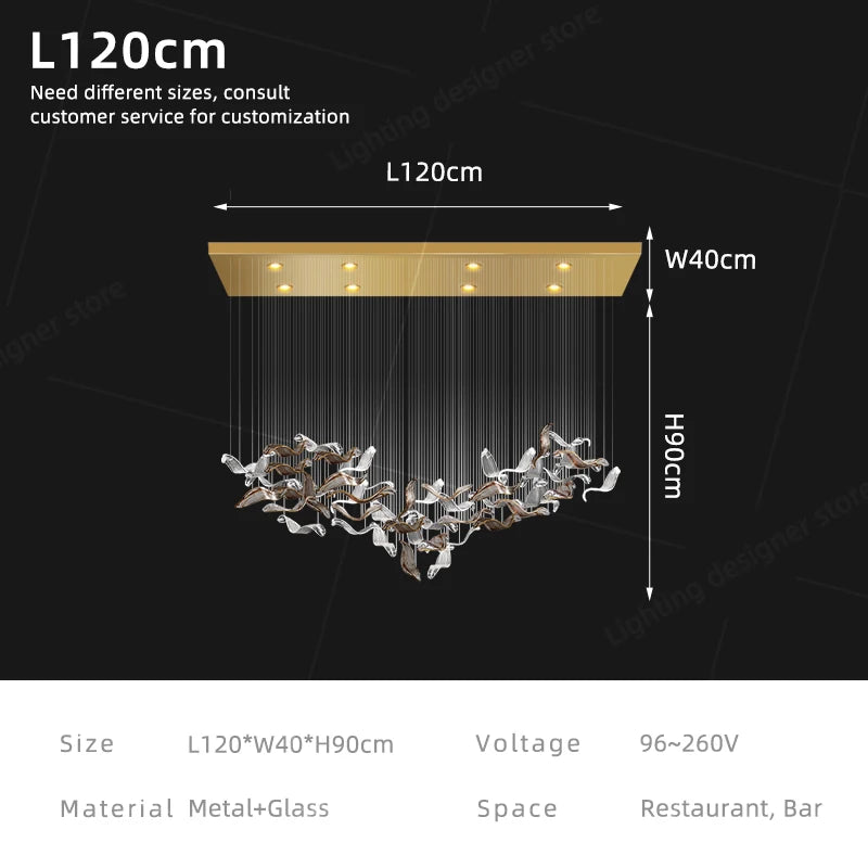Linear glass chandelier shown lit in warm 3000K LED light