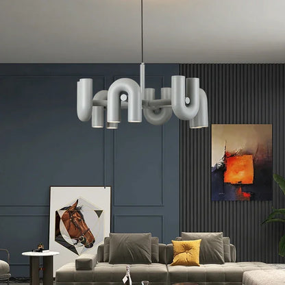 Grey U shaped chandelier washing light upward from a shadeless body