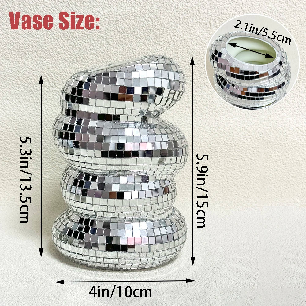 Top-down view of silver mirrored mosaic tiles on glass disco ball vase