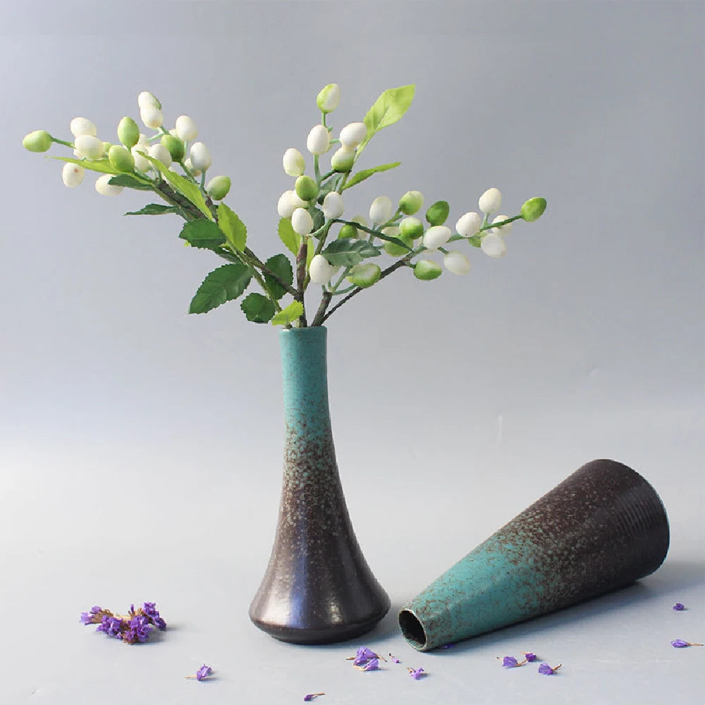 Black ceramic bud vase in rounded D shape for minimalist Japandi shelf decor