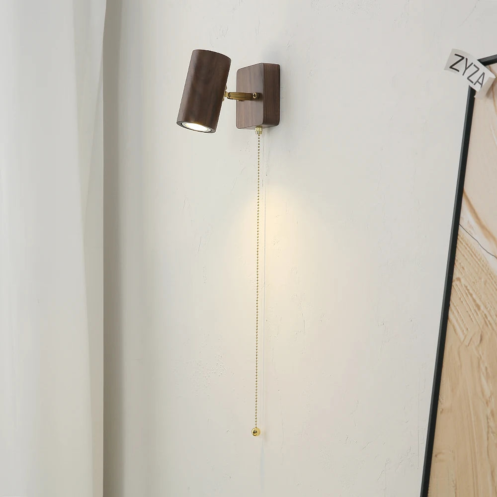 walnut wood wall sconce, installed in a room interior setting