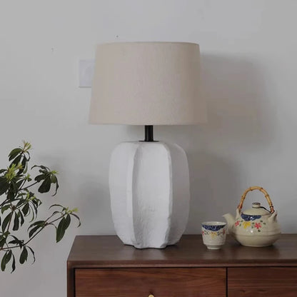 Close-up of textured handmade clay surface on pottery lamp base