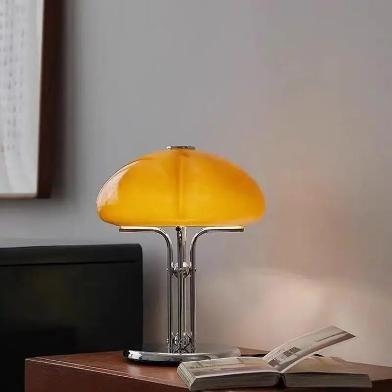 Bauhaus lamp on bedroom nightstand warm mode glowing on wall