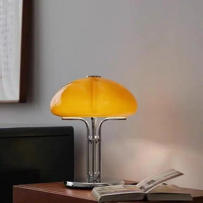 Bauhaus lamp on bedroom nightstand warm mode glowing on wall