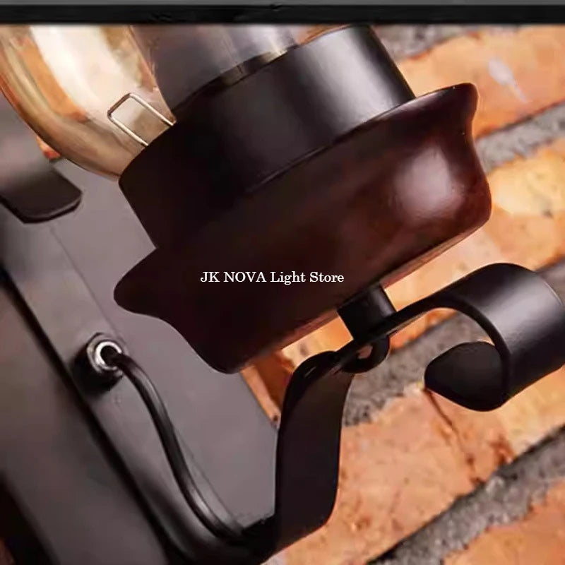 iron wall sconce, detail view of fixture base and arm