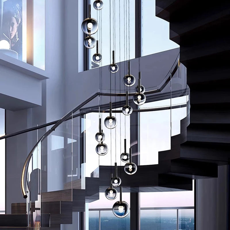Faceted glass staircase chandelier hung from an ironware ceiling canopy