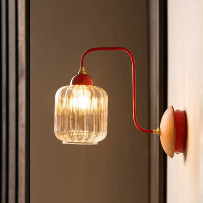 amber glass wall sconce, installed in a room interior setting