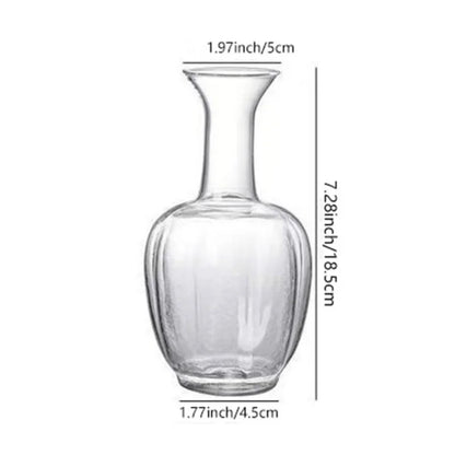 Macro detail of cylindrical glass vase base showing full transparent clarity