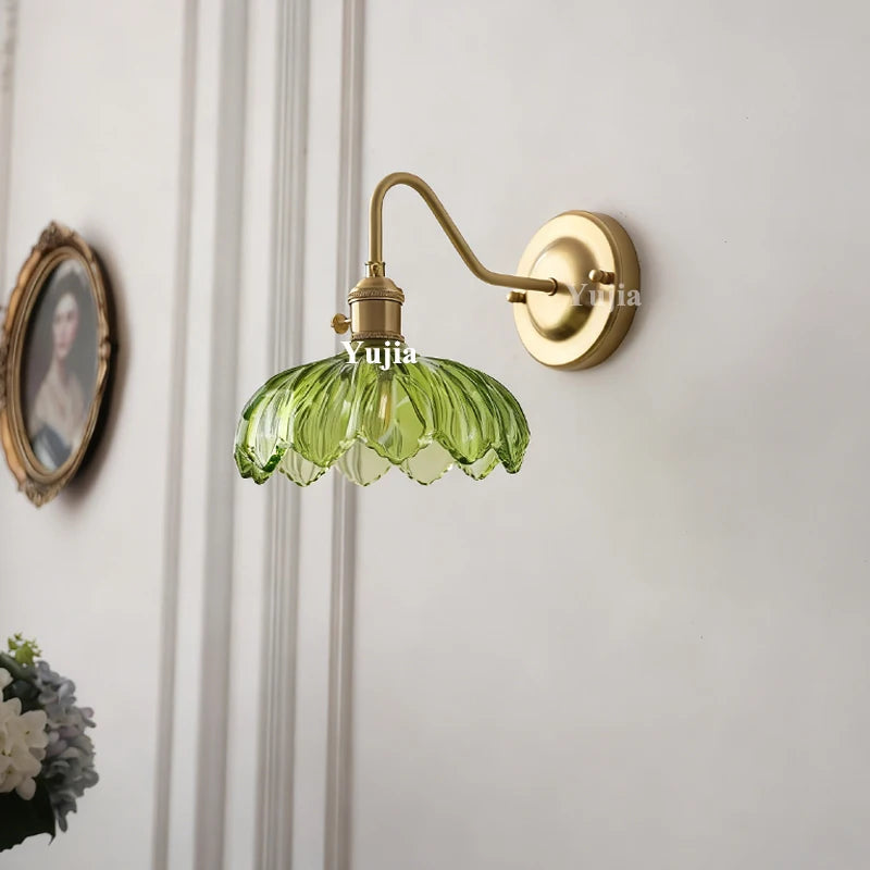 brass wall sconce, detail view of fixture base and arm